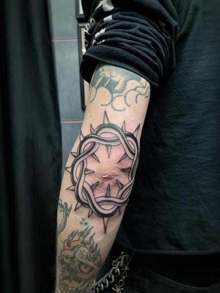 Blackwork thorn circle tattoo by @george_thirst