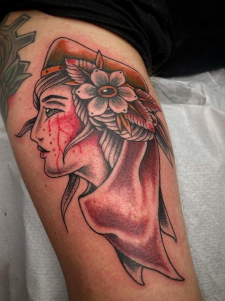 Traditional woman with flower tattoo by @george_thirst