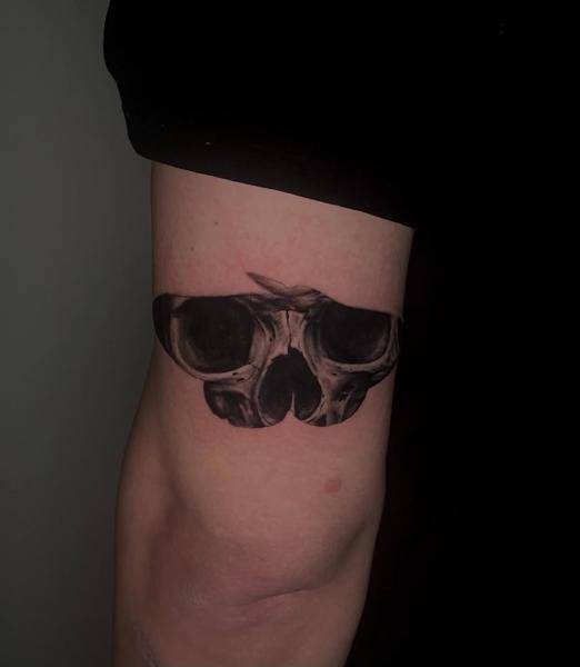 Realism moth skull tattoo by @kazatattoos