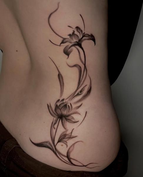 Fine line floral design tattoo by @kazatattoos