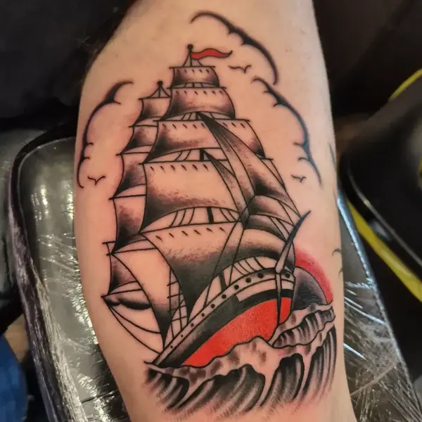 Traditional sailing ship tattoo by @georgiamarshalltattoo