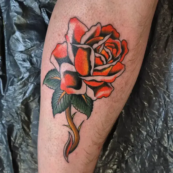 Traditional traditional rose tattoo by @georgiamarshalltattoo