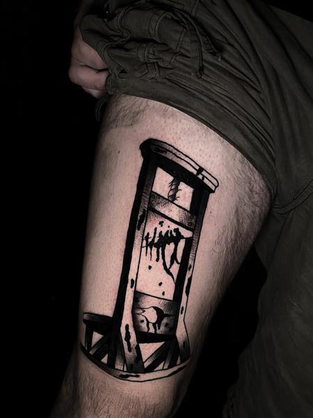 Blackwork guillotine tattoo by @lahaine_tattoo