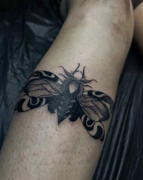 Blackwork moth tattoo by @lahaine_tattoo