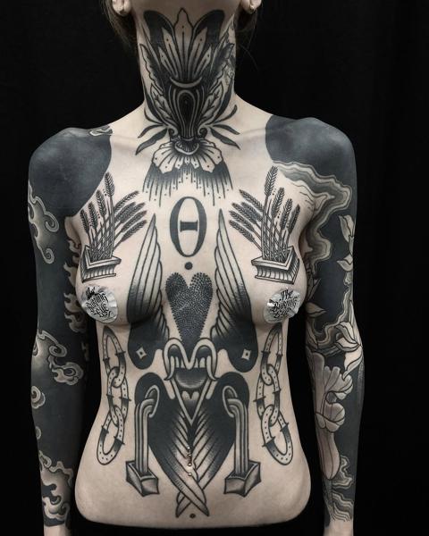 Blackwork ornamental ornamental chest tattoo by @danetattoo