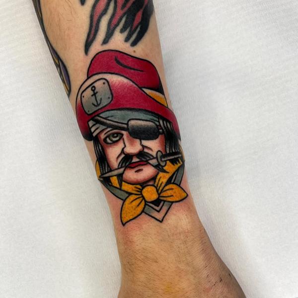 Traditional pirate head tattoo by @danetattoo