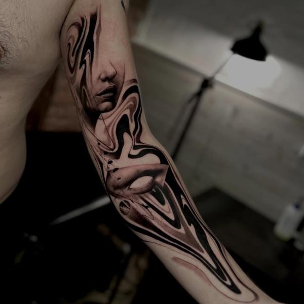 Realism abstract face tattoo by @_mikotattoo