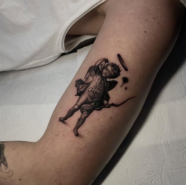 Blackwork blindfolded cherub tattoo by @painciler