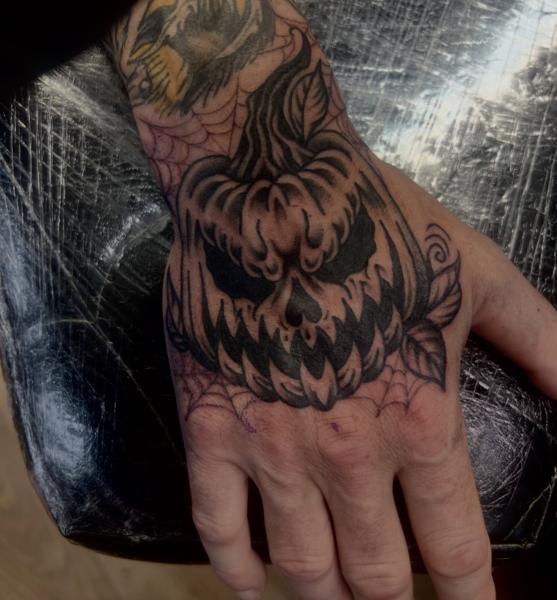 Blackwork pumpkin face tattoo by @gnarly_.charlie_