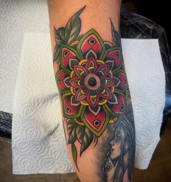 Traditional mandala flower tattoo by @gnarly_.charlie_