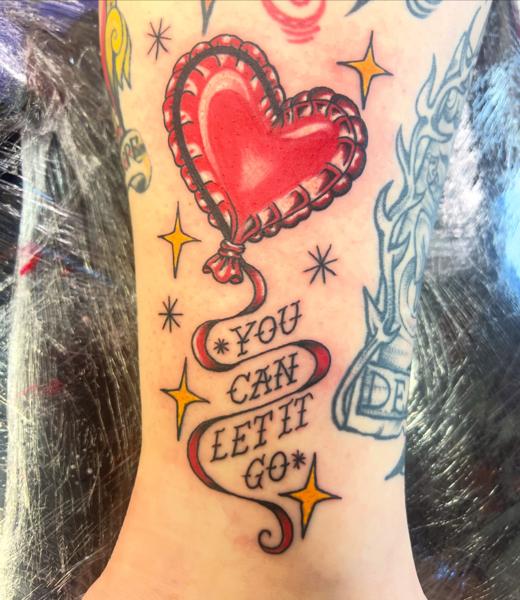 Traditional heart balloon tattoo by @gnarly_.charlie_