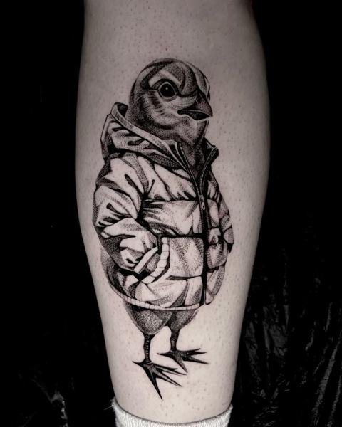 Illustrative bird in jacket tattoo by @luvnroll