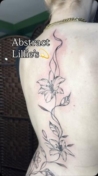 Fine line abstract lilies tattoo by @gracebtattoos