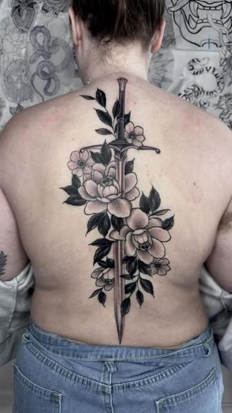 Blackwork floral dagger tattoo by @greharptattoo