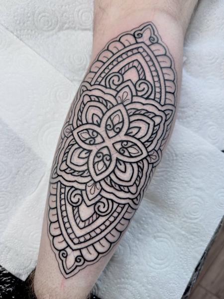 Ornamental mandala pattern tattoo by @greharptattoo