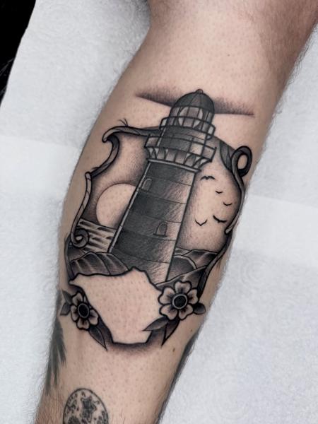 Blackwork lighthouse scene tattoo by @greharptattoo