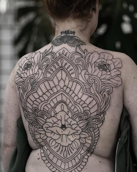 Ornamental ornamental floral tattoo by @griff.tattoo
