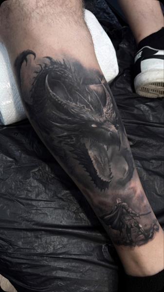 Realism dragon and knight tattoo by @g.u.tattoo.uk