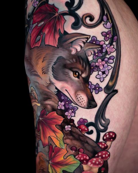 Realism wolf with leaves tattoo by @hannahsteeleart