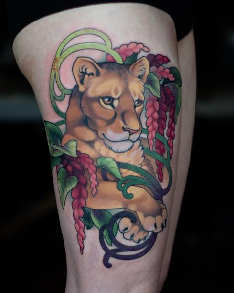 Illustrative lion with flowers tattoo by @hannahsteeleart