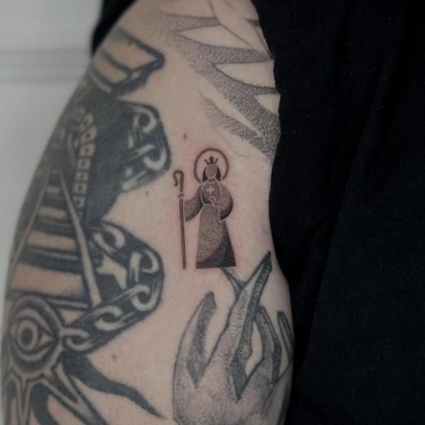 Minimalist saint figure tattoo by @mystickyfingers_