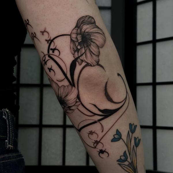 Fine line floral crescent tattoo by @mystickyfingers_
