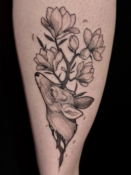 Blackwork deer with flowers tattoo by @helle.ink