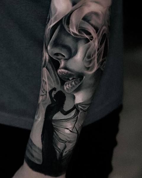 Black and grey realism woman smoke silhouette tattoo by @hellekarger_tattoo