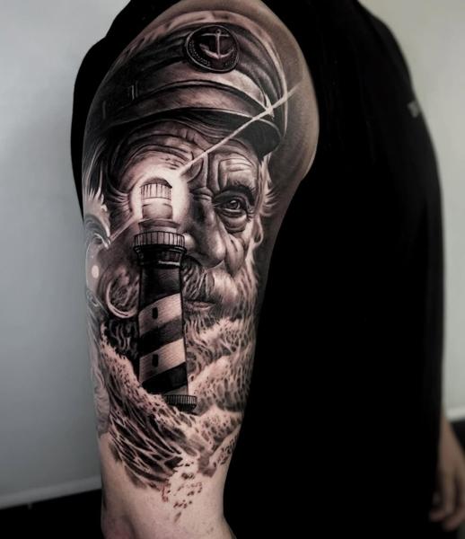 Realism captain lighthouse tattoo by @hermit_ttt