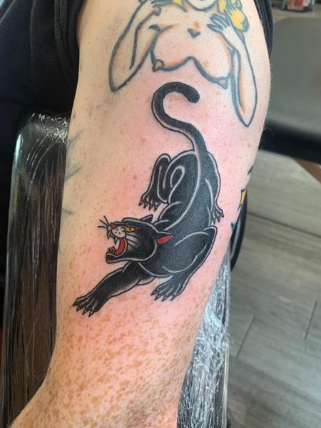 Traditional panther tattoo by @hollielimertattoo