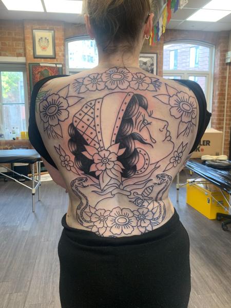 Traditional woman and flowers tattoo by @hollielimertattoo