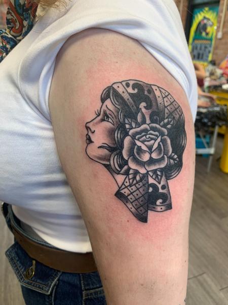 Traditional woman's profile tattoo by @hollielimertattoo
