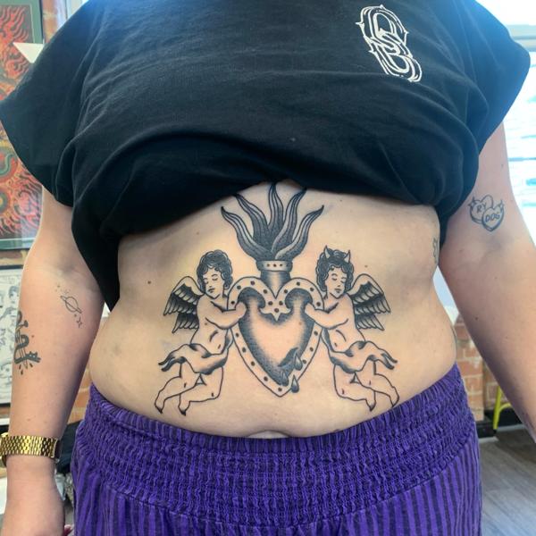 Traditional cherubs and heart tattoo by @hollielimertattoo