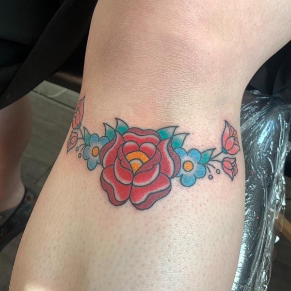 Traditional floral design tattoo by @hollielimertattoo