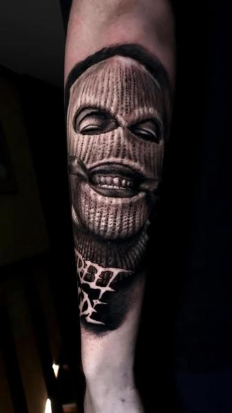 Realism masked face tattoo by @ilias_lab