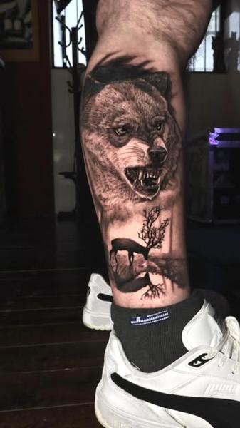 Realism wolf portrait tattoo by @ilias_lab
