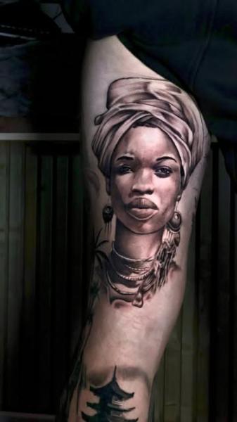 Realism woman portrait tattoo by @ilias_lab