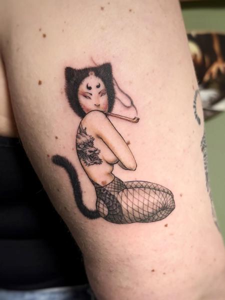 Illustrative masked cat woman tattoo by @60needle