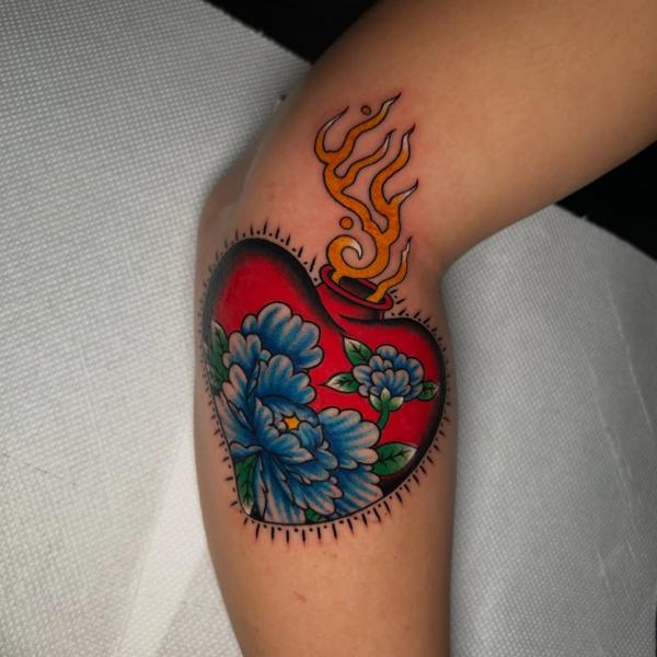 Traditional flaming heart tattoo by @ziggi_tattoos