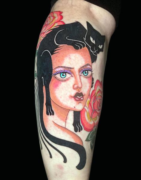 Traditional woman with cat tattoo by @inmatattooartist