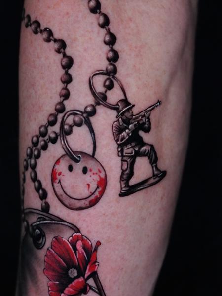 Realism smiley face and soldier tattoo by @inx.tattoo