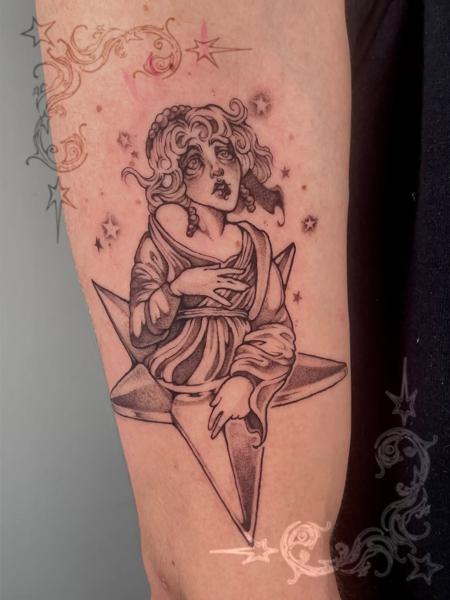 Blackwork angelic figure tattoo by @dollmadaki.tattoos