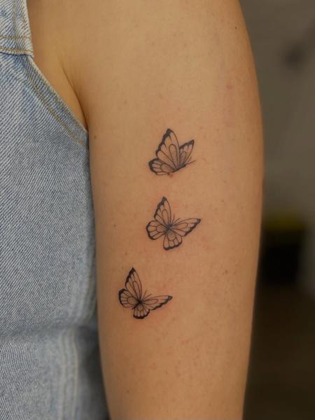 Fine line flying butterflies tattoo by @izit_ink