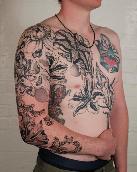 Blackwork floral design tattoo by @jackhowardtattoo