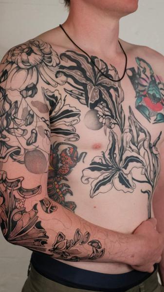 Blackwork floral design tattoo by @jackhowardtattoo