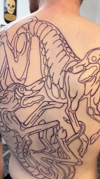 Linework dinosaur skeleton tattoo by @jackhowardtattoo