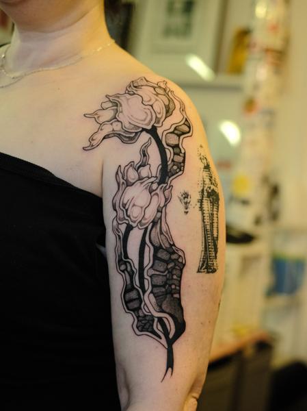 Blackwork abstract floral tattoo by @jackhowardtattoo