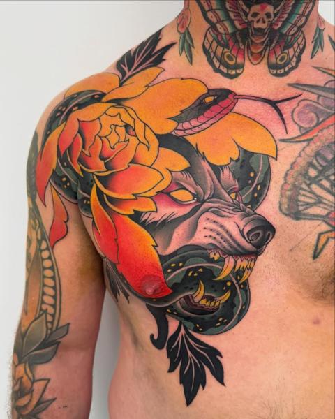 Traditional wolf and flowers tattoo by @jacobbrask88