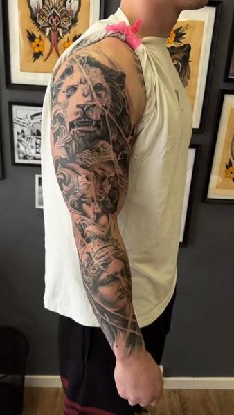 Realism lion and statues tattoo by @jacobbrask88
