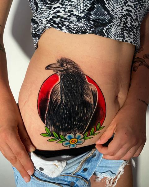 Illustrative raven with flower tattoo by @jaimikotattoo